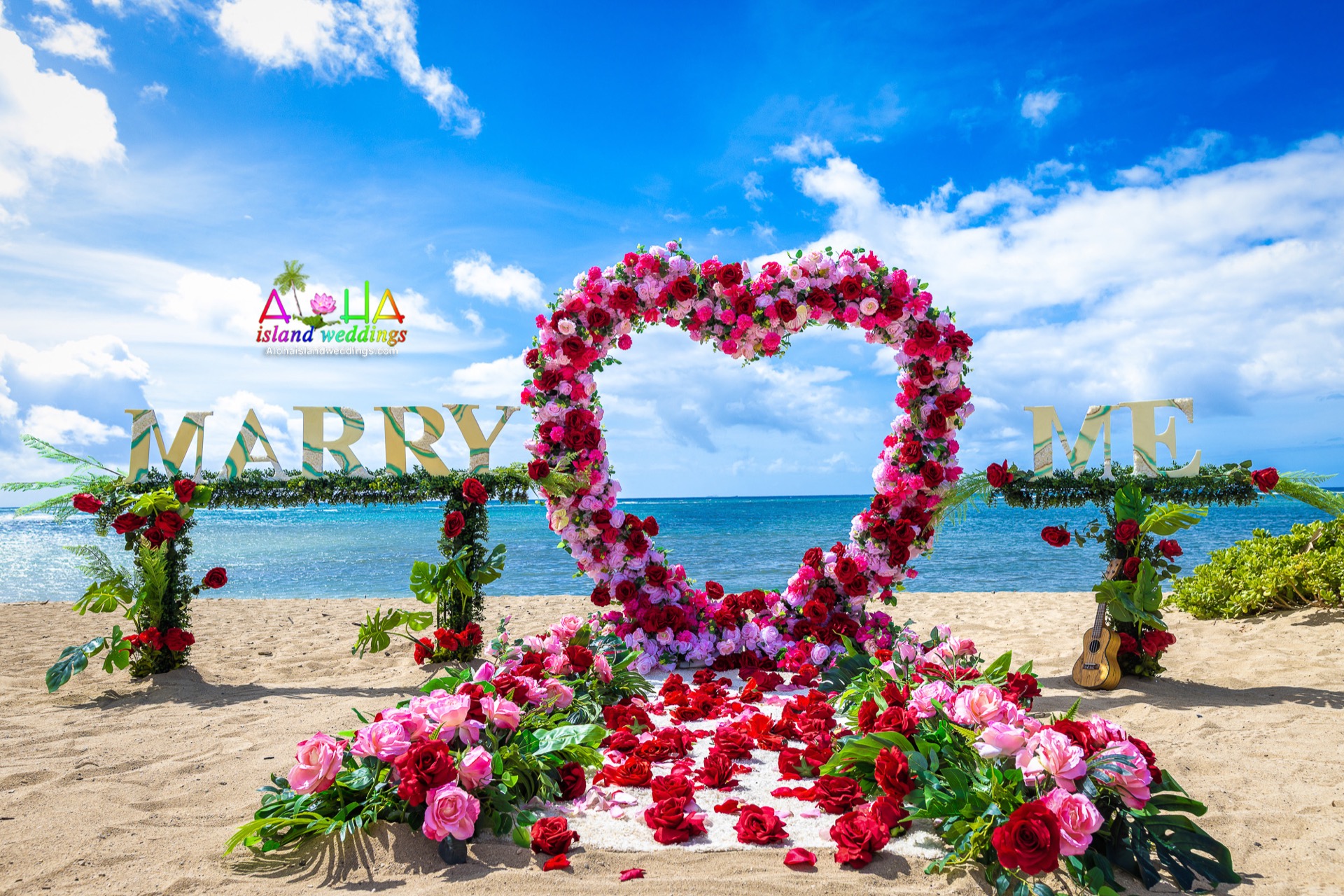 Red rose heart with a Marry Me sign for a beach proposal in Hawaii